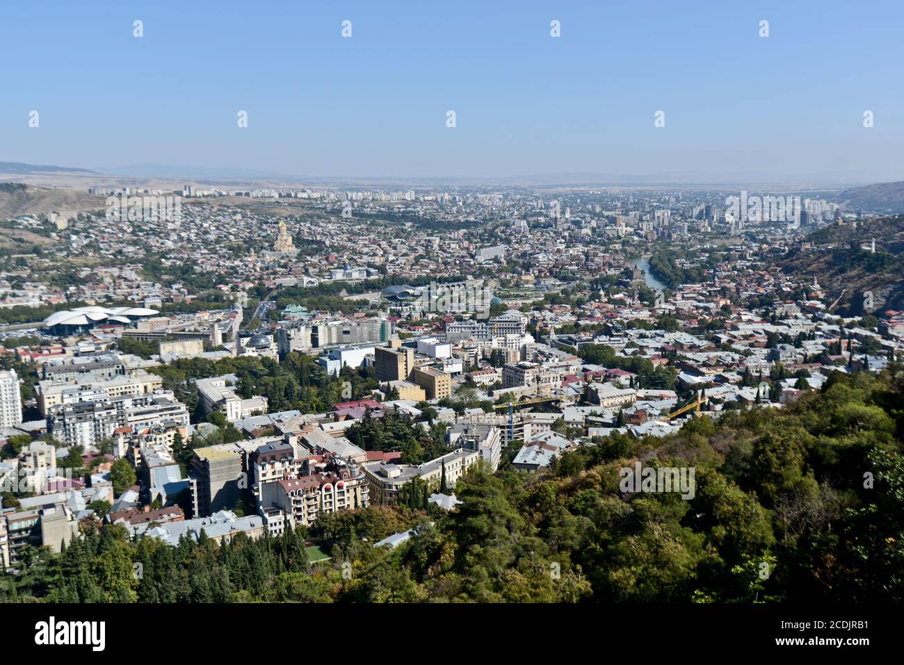 Panoramic view of Tbilisi from Mount Mtatsminda: The Holy Trinity Cathedral of Tbilisi, Kura River, Bridge of Peace. Republic of Georgia Stock Photo