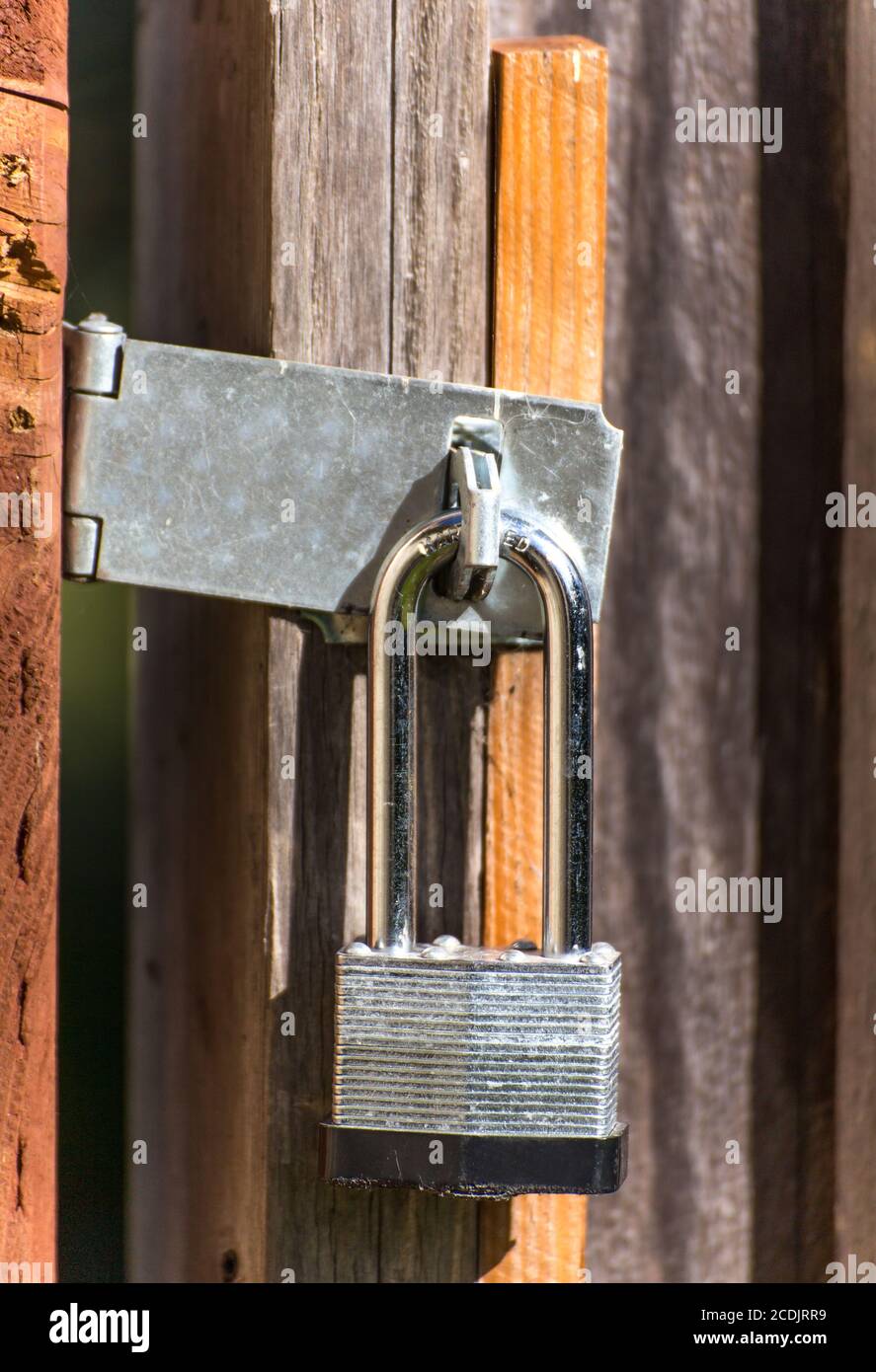 Closed Wood Gate Protected by Strong Lock Stock Photo