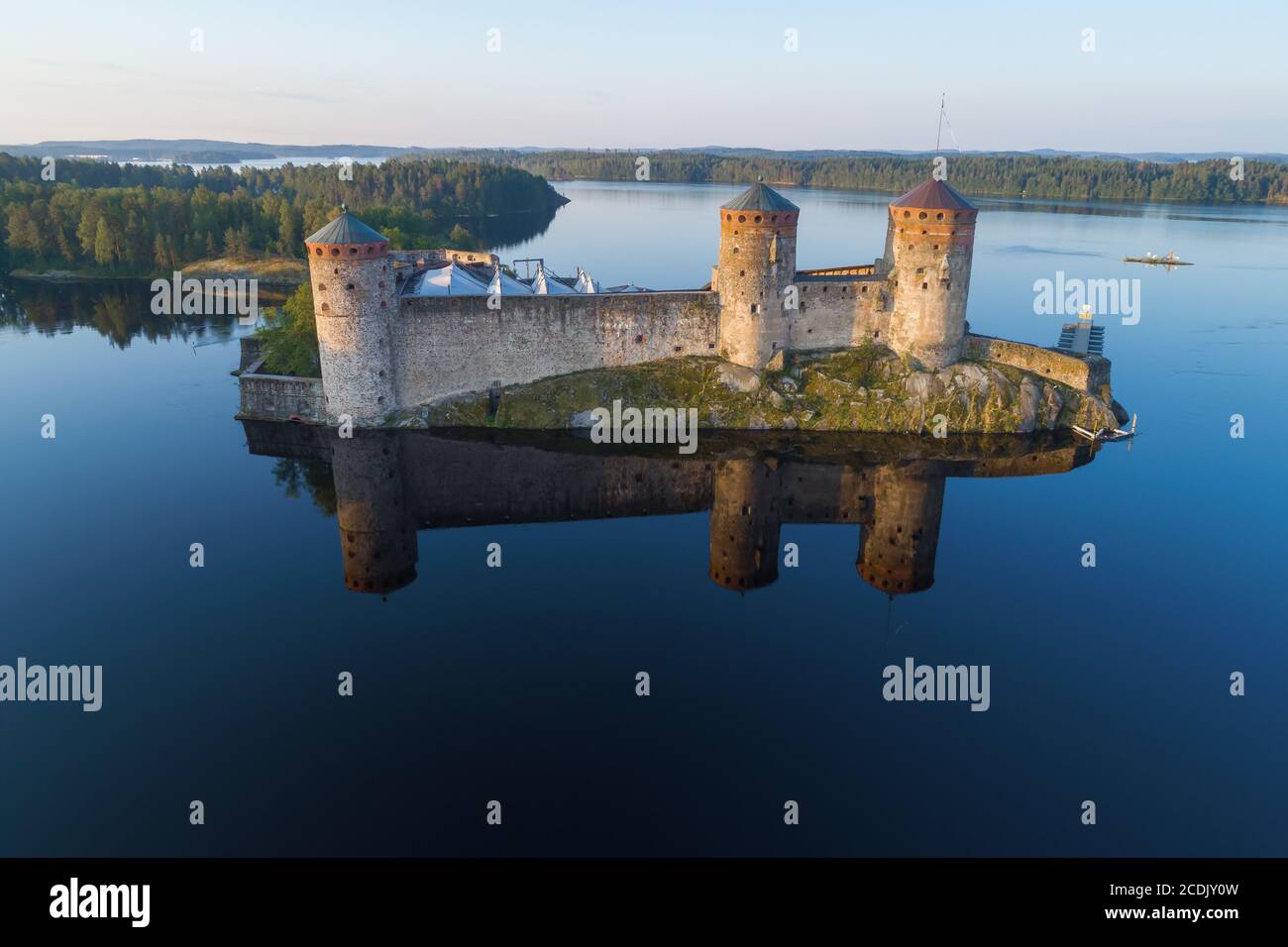 View of the medieval fortress of Olavinlinna early July morning (aerial photography). Savonlinna, Finland Stock Photo