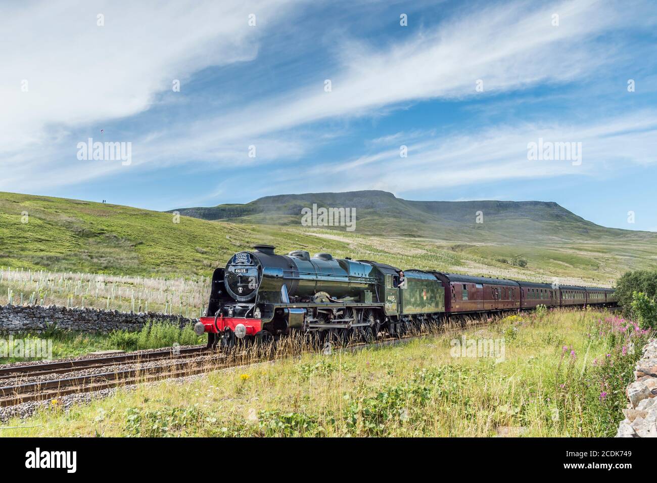 This is the LMS Royal Scot Class 7P 4-6-0 46115 Scots Guardsman passenger steam train approaching Aisgill summit on the Settle to Carlisle Line Stock Photo