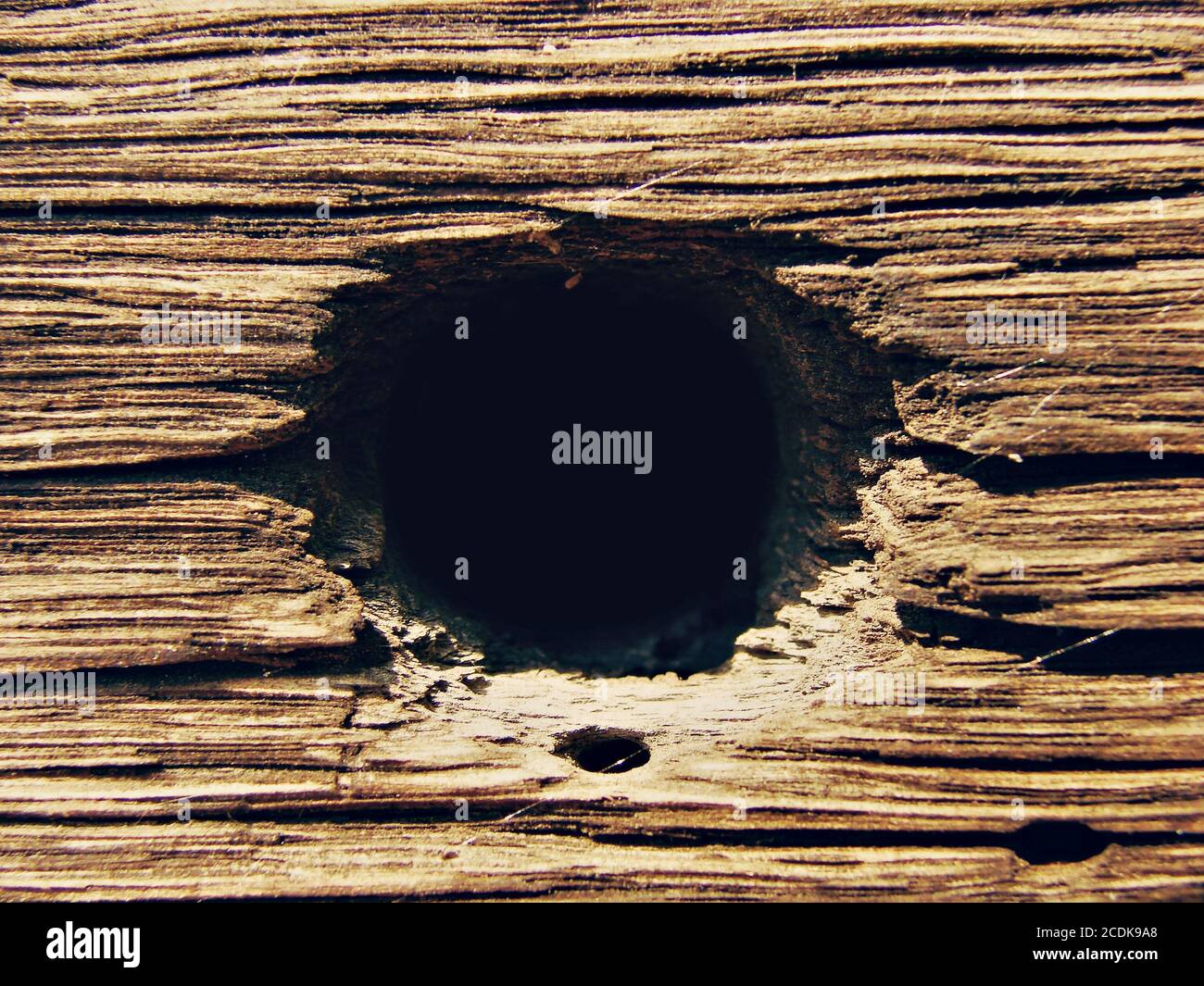 Wooden background with hole Stock Photo - Alamy