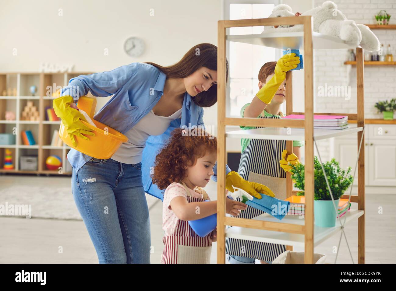 Family cleaning house, hygiene. Cleanliness and tidiness, housecleaning. Stock Photo