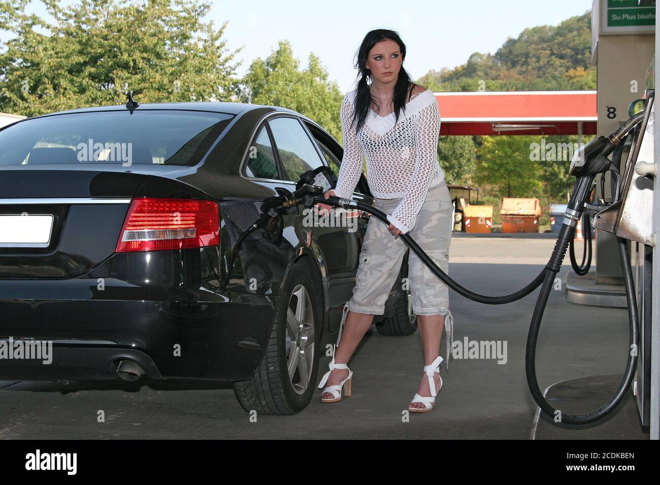 Woman filling up Stock Photo