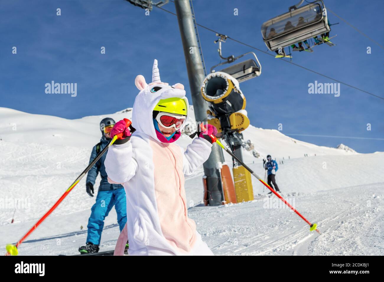 Cute adorable preschooler caucasian kid girl portrait with ski in helmet,  goggles and unicorn fun costume enjoy winter sport activities. Little child  Stock Photo - Alamy