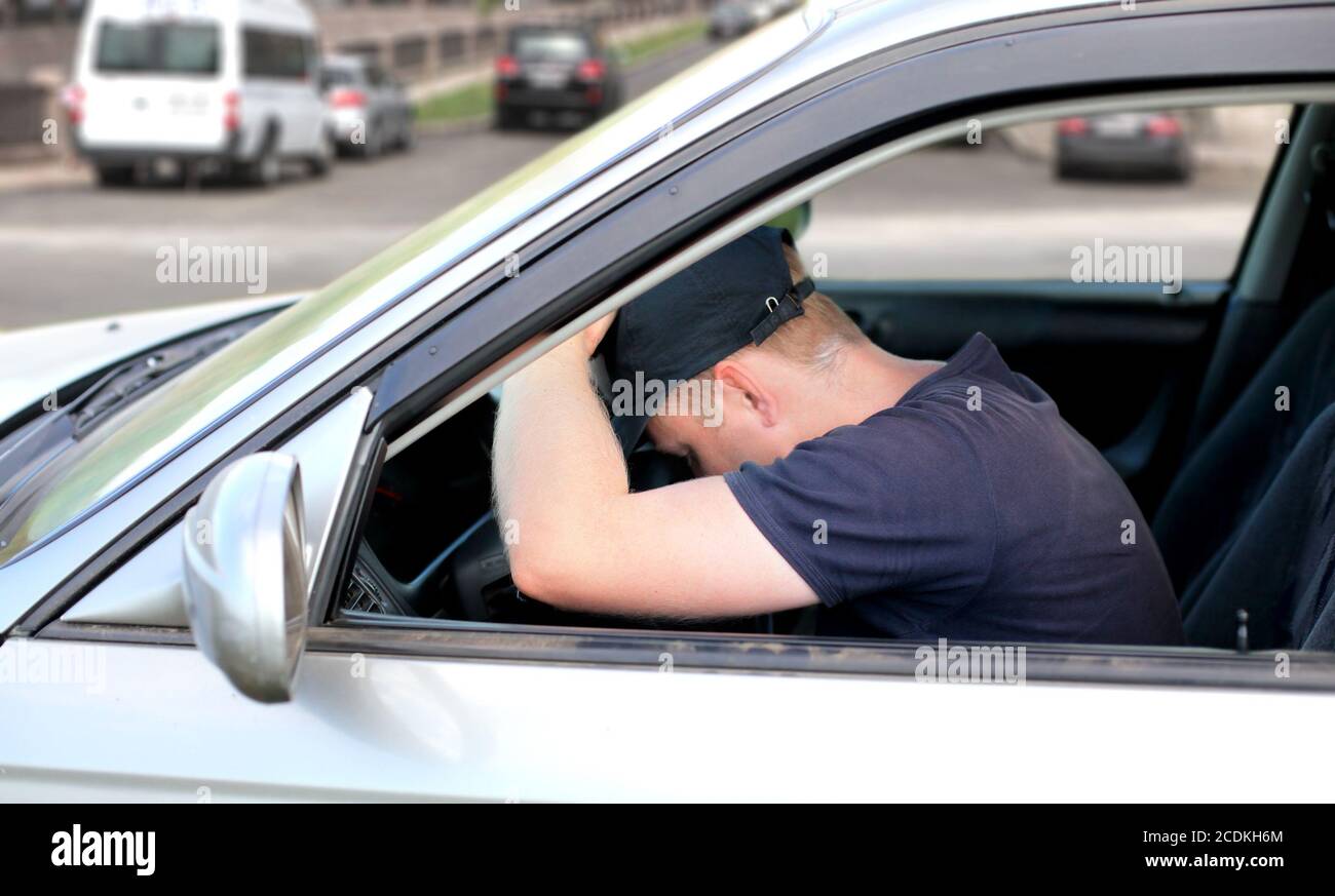 Man fall asleep in the Car Stock Photo