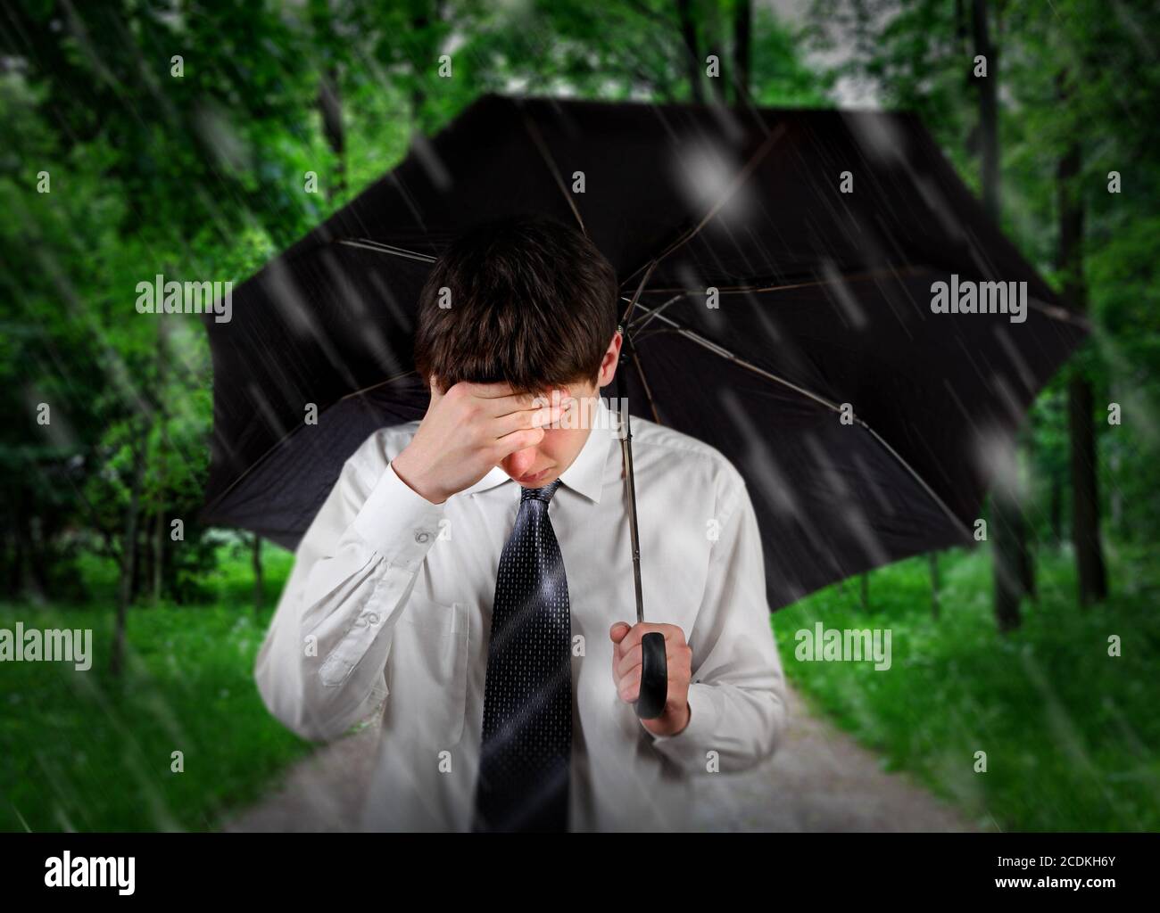 Sad Man under Rain Stock Photo