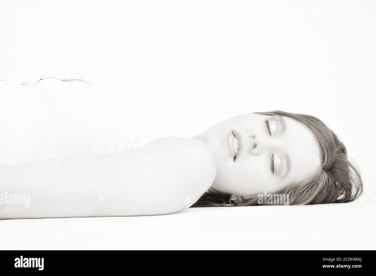 Beautiful model lying on the studio floor Stock Photo