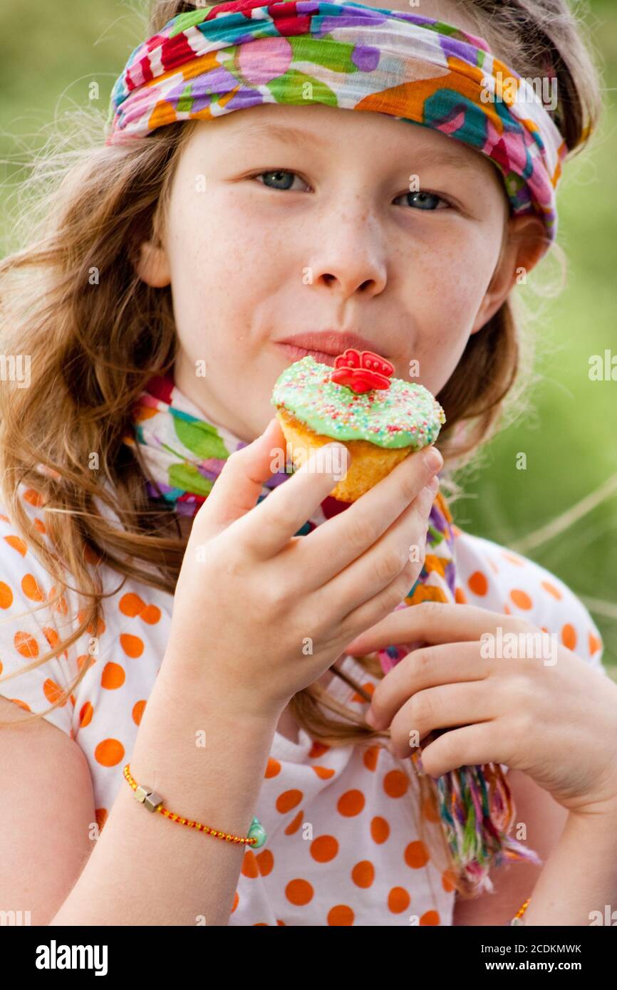 Eating a cupcake Stock Photo