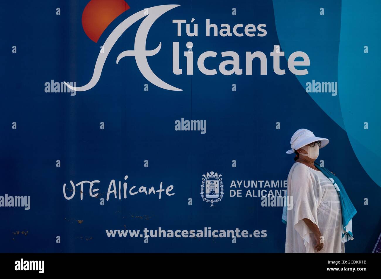 Alicante, Spain. 28th Aug, 2020. A woman wearing a face mask to protect