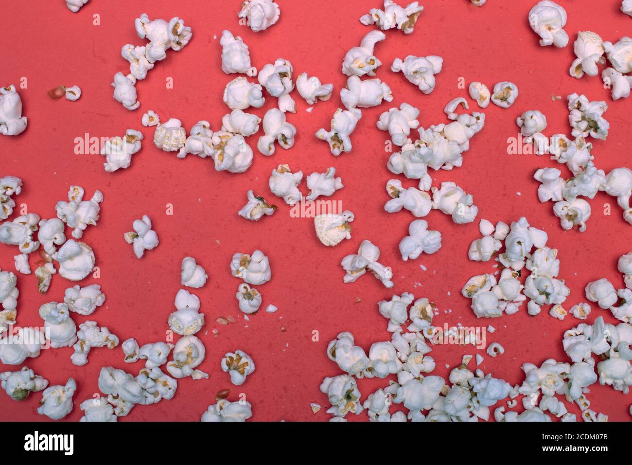 Popcorn on a red background Stock Photo