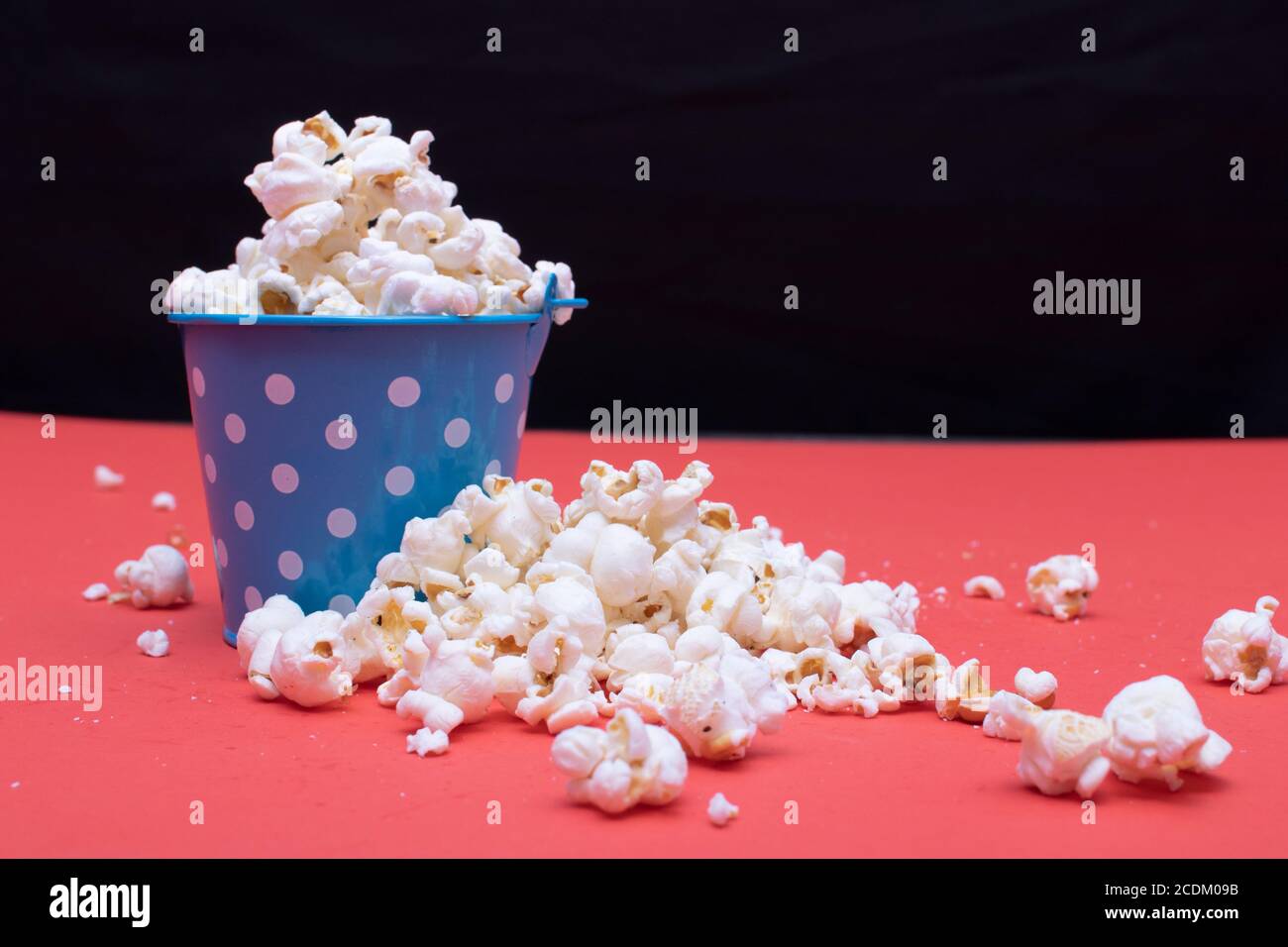 Popcorn on a red background Stock Photo