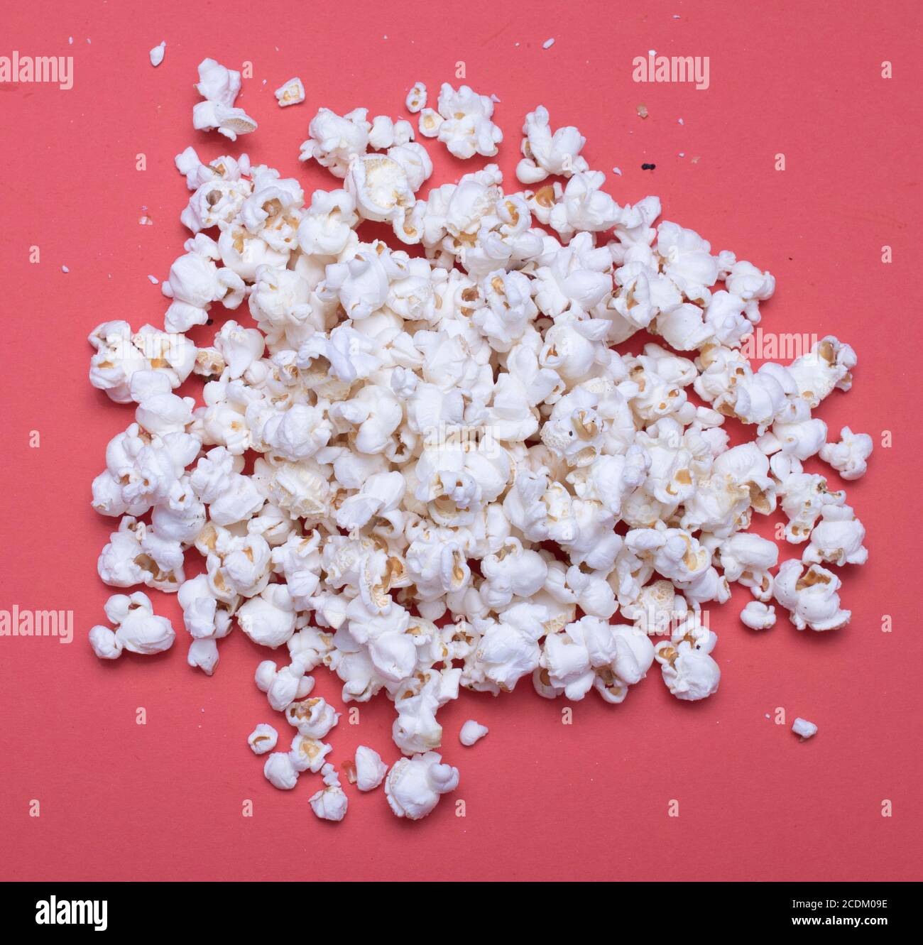 Popcorn on a red background Stock Photo