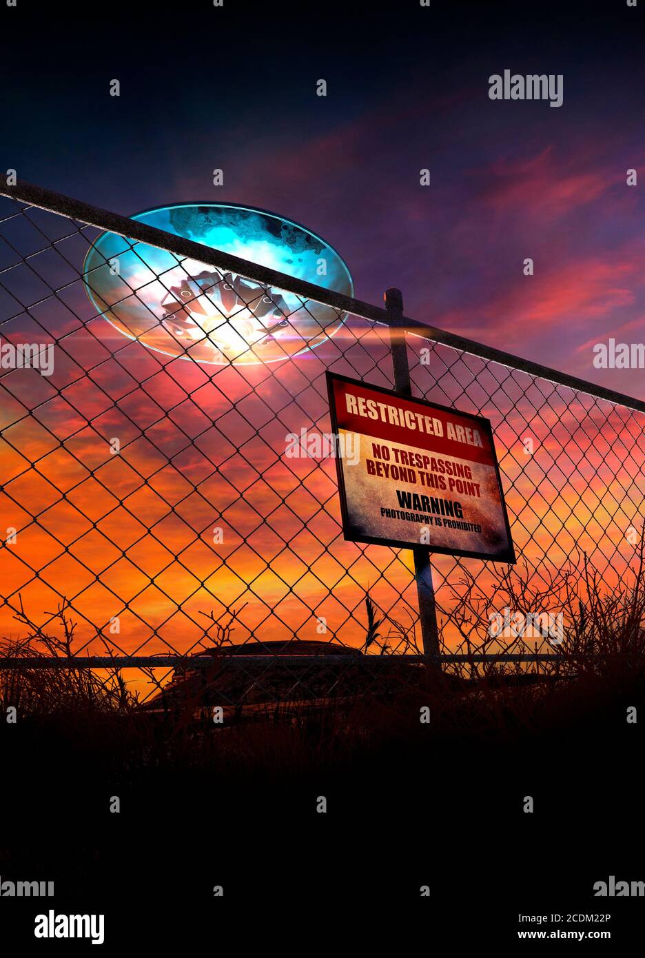 Unidentified flying object (UFO) flying over a restricted military area, conceptual illustration. Stock Photo