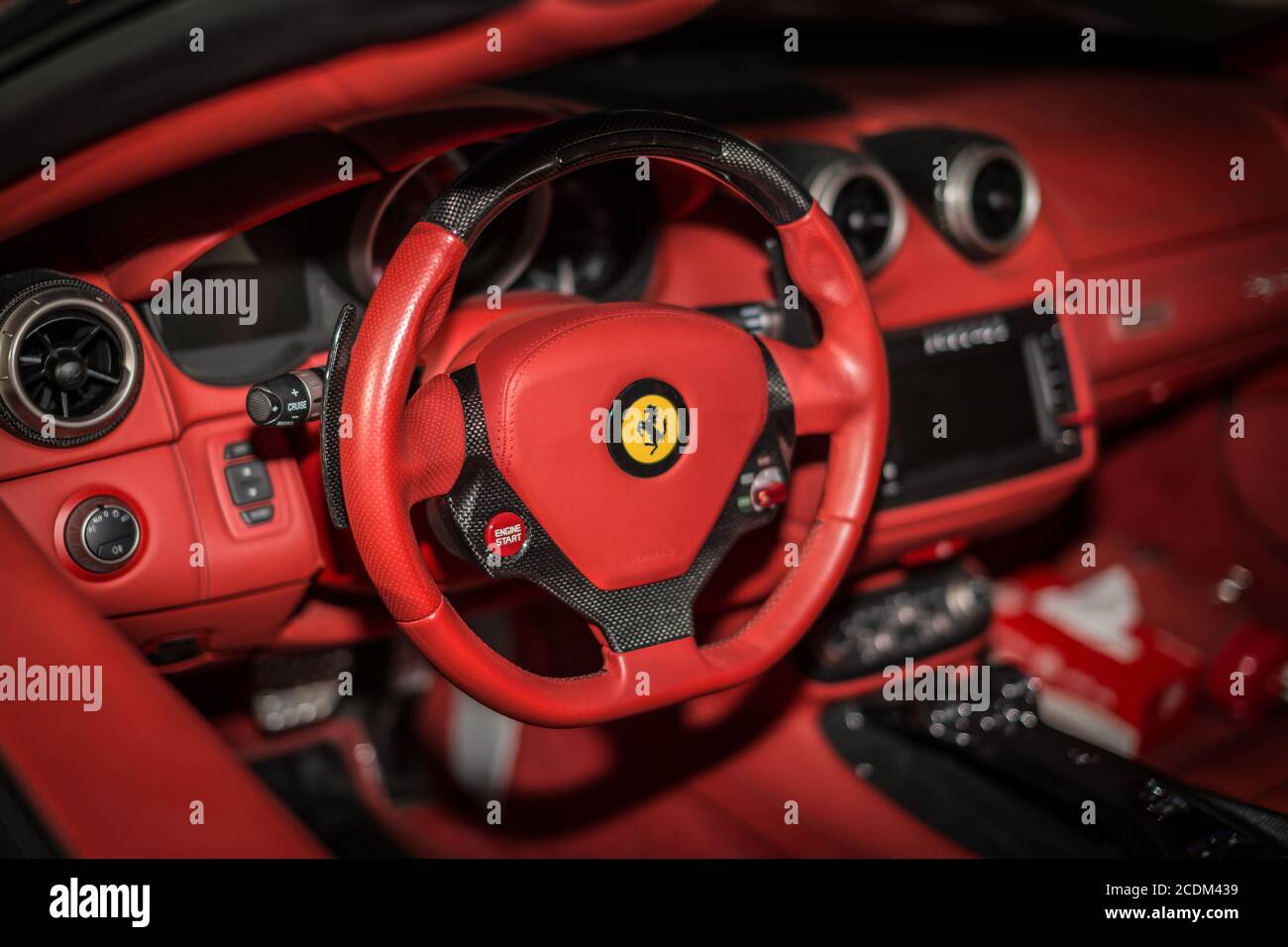 Ferrari F12 Berlinetta V12 GT sports car red dashboard interior shot  showing the driving wheel in focus Stock Photo - Alamy