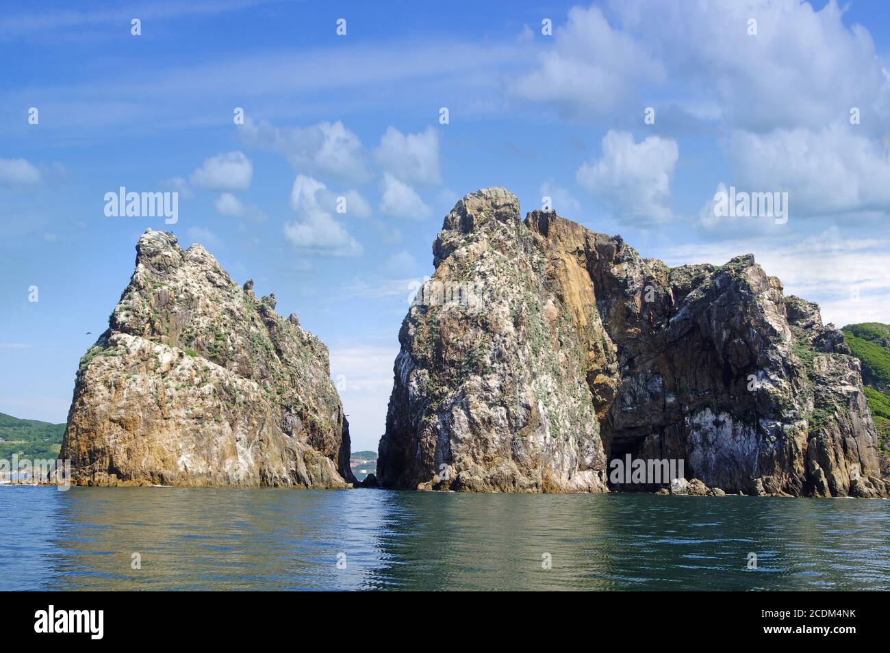 Blue sea brown rocks hi-res stock photography and images - Alamy