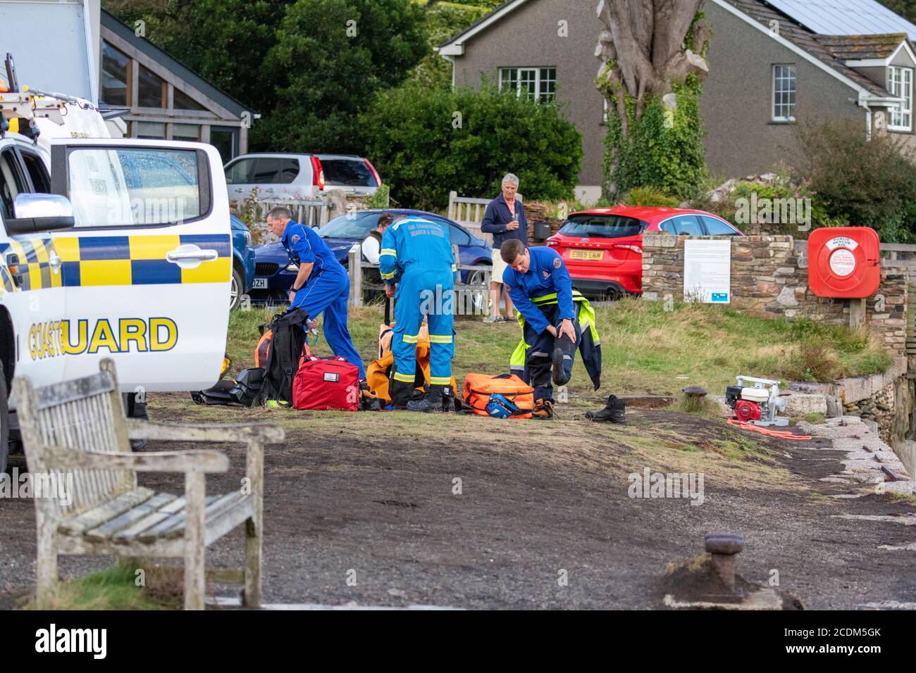 Rescue of Hire Boat boat aground in Restonguet Creek, Cornwall.  High tide is not due to float them off until 03AM and bad weather is expected. Stock Photo