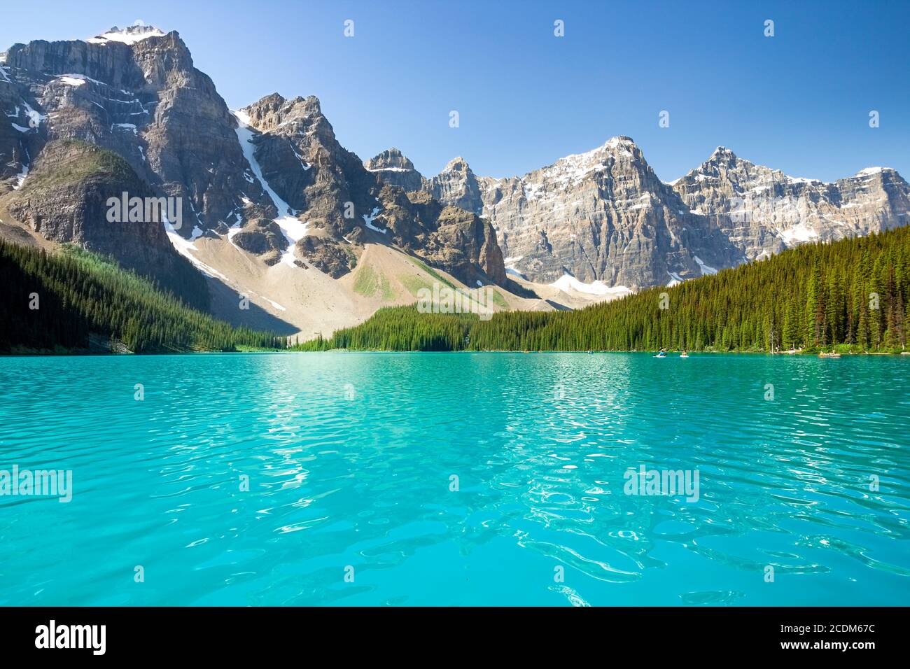 Beautiful Canadian famous turquoise Moraine Lake, Banff National Park, AB. The view on the valley of the ten peaks. Blue sky in the background. Stock Photo