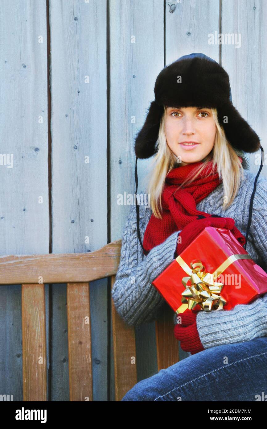 Woman holding Christmas gift Stock Photo