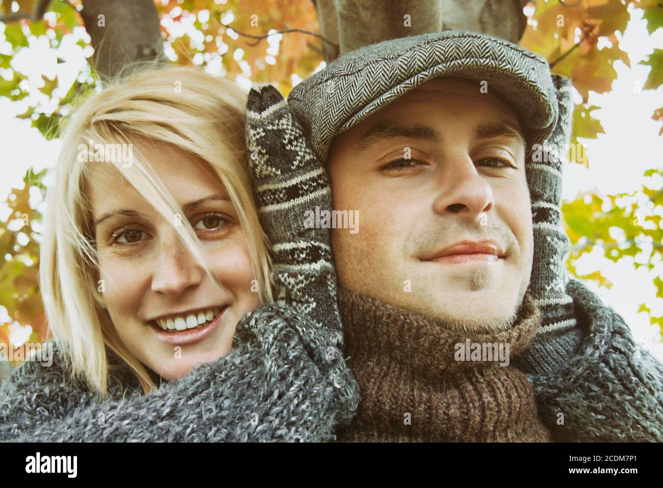 Young couple having some outdoor autumn fun Stock Photo
