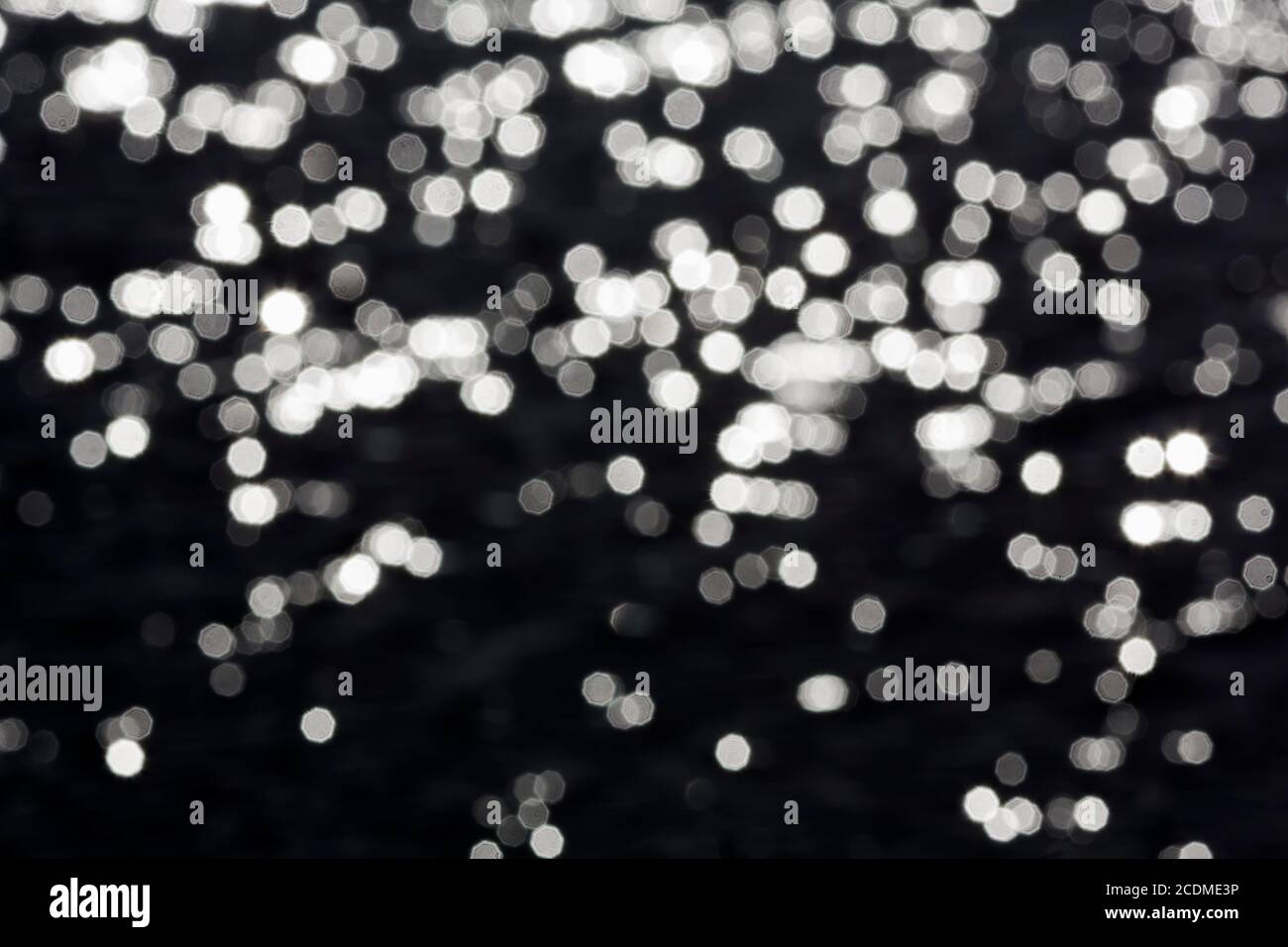 Abstract black background with sparkling white lights, Italy Stock Photo