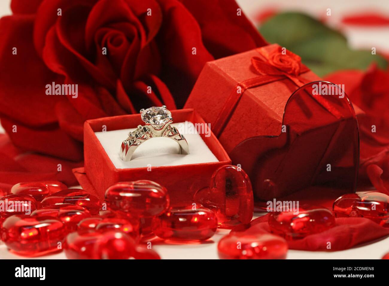 Red hearts and rose with wedding ring Stock Photo