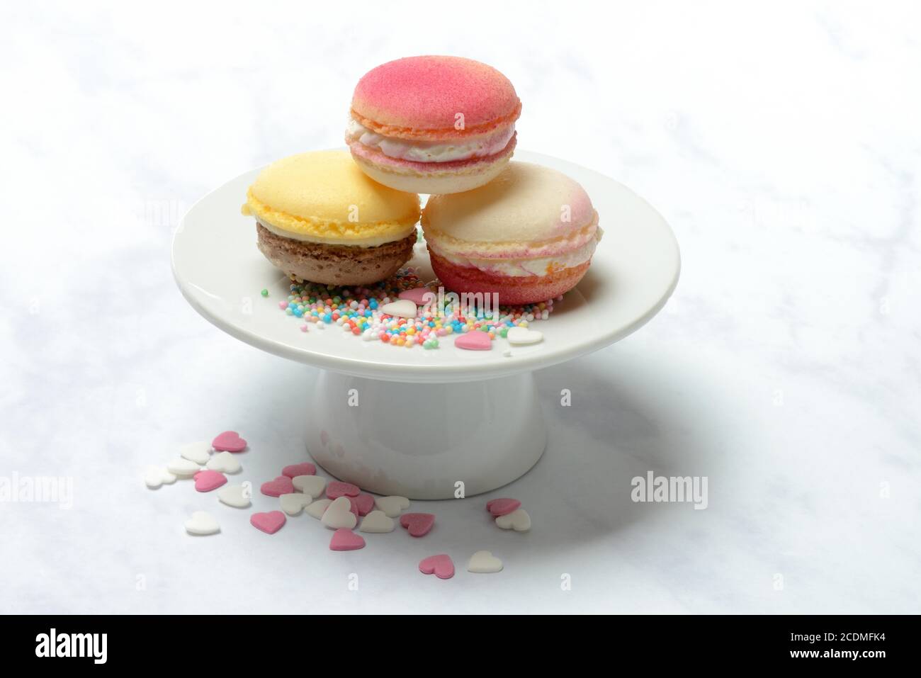 Macarons on decorative plate, Germany Stock Photo