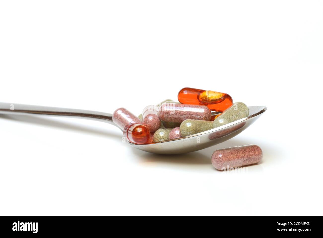 Capsules with food supplements in spoon, Germany Stock Photo Alamy