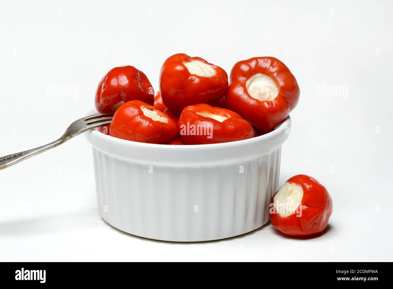 Cherry peppers in shell filled with cream cheese, Germany Stock Photo
