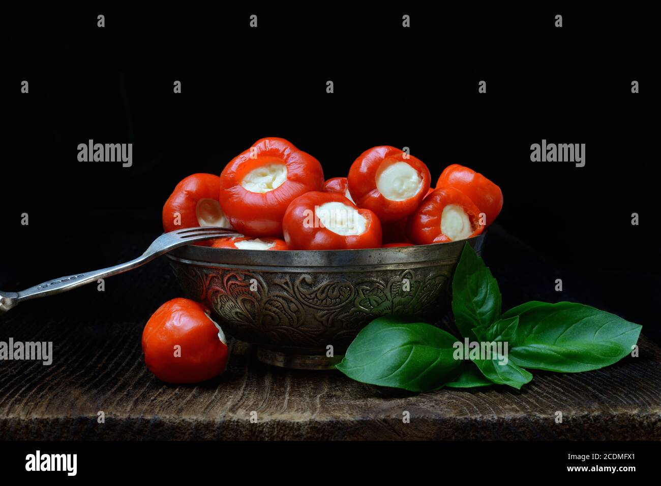 Cherry peppers in shell filled with cream cheese, Germany Stock Photo Alamy