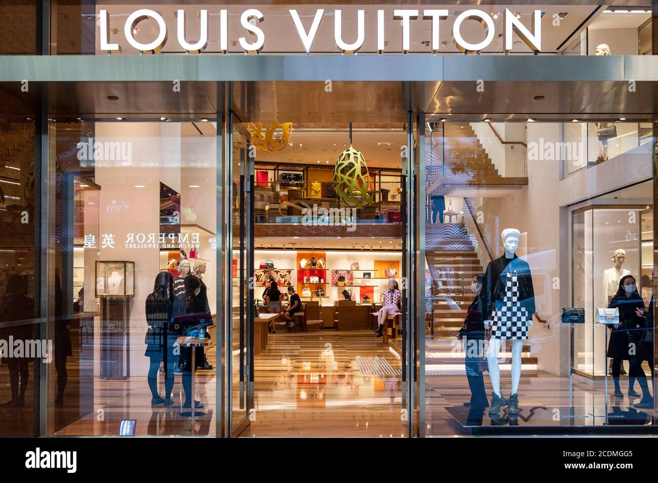 Pedestrians are seen in front of a French luxury fashion brand Louis Vuitton  (LV) store in Hong Kong. (Photo by Budrul Chukrut / SOPA Images/Sipa USA  Stock Photo - Alamy