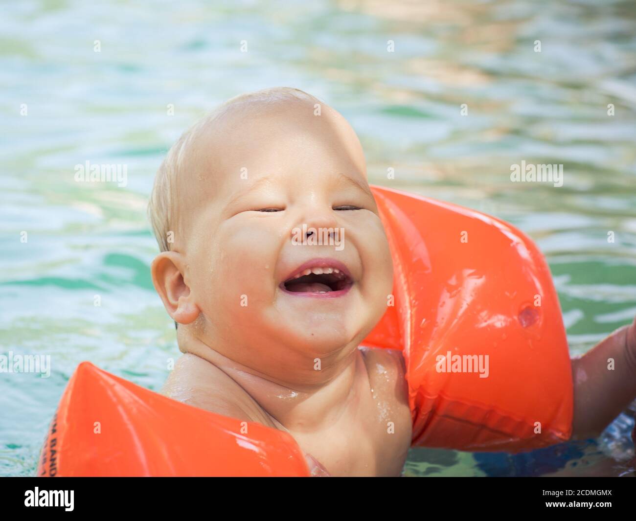 Baby with armbands Stock Photo Alamy