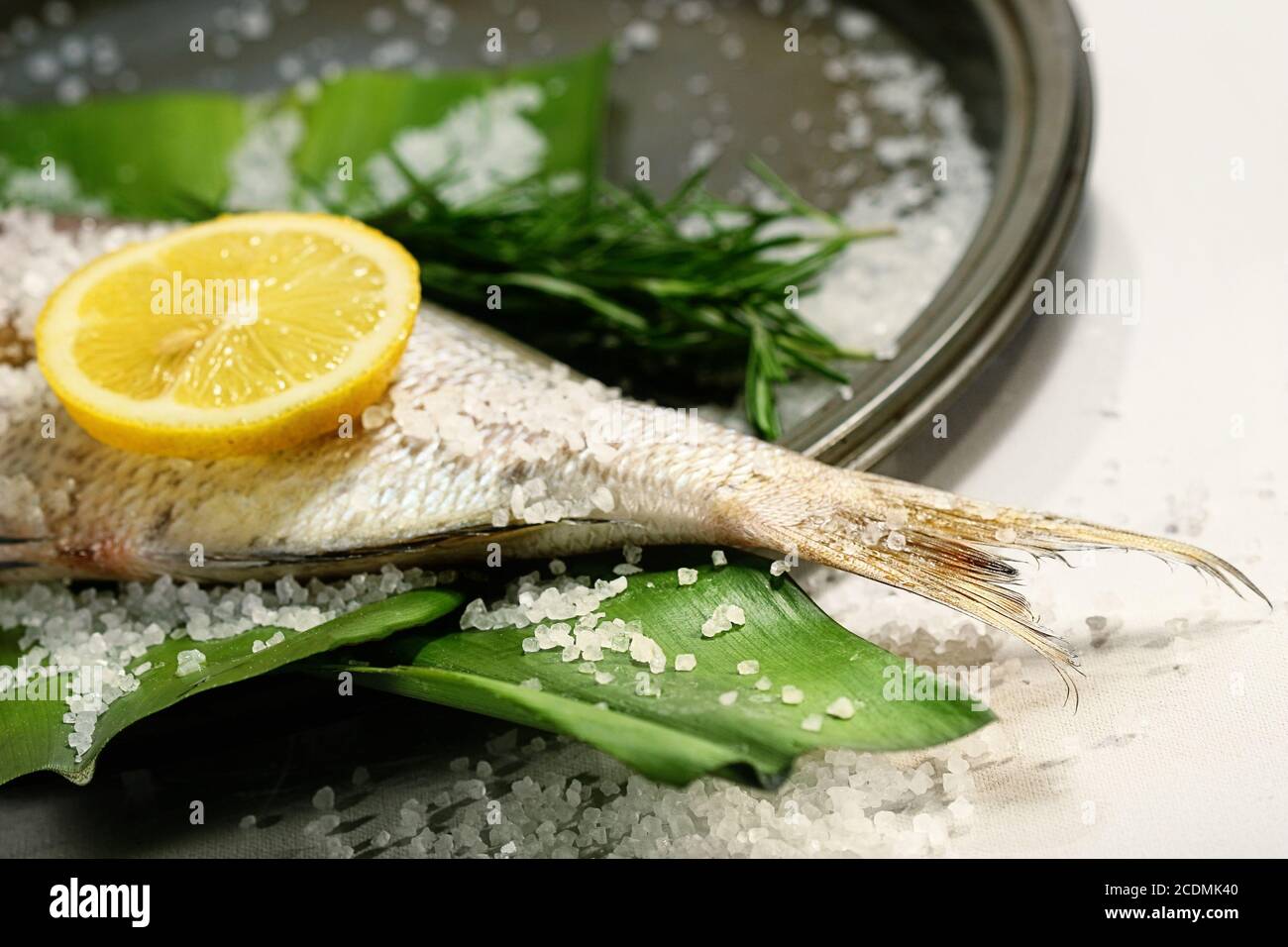 Fish tale with lemon, alt and herbs Stock Photo