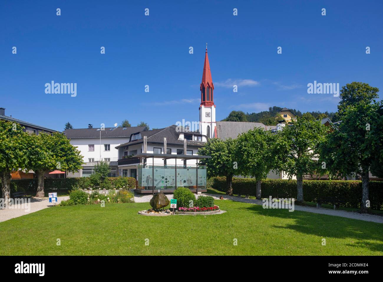 Lake promenade with pile-dwelling village pavilion and protestant church, Attersee am Attersee, Salzkammergut, Upper Austria, Austria Stock Photo