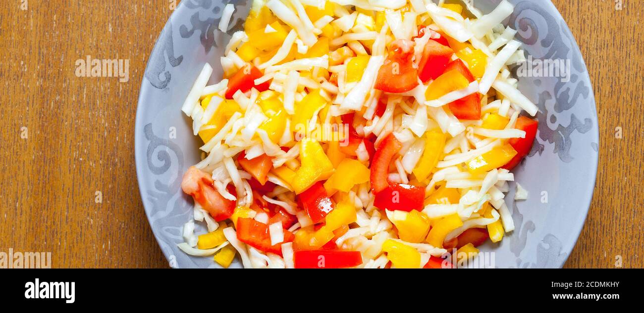 salad with fresh vegetables in plate Stock Photo