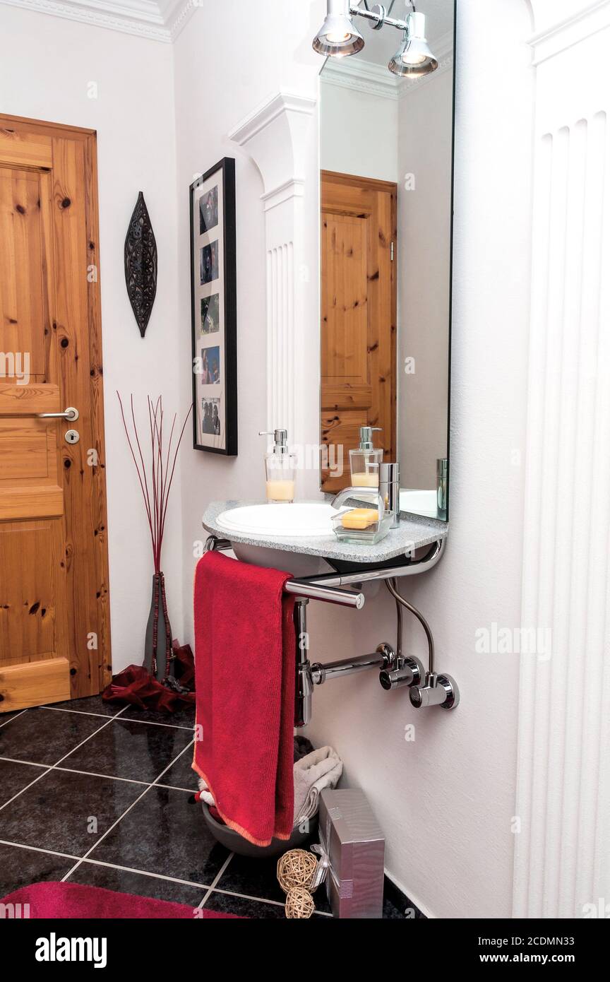 Modern design guest bathroom in black-white-red co Stock Photo - Alamy