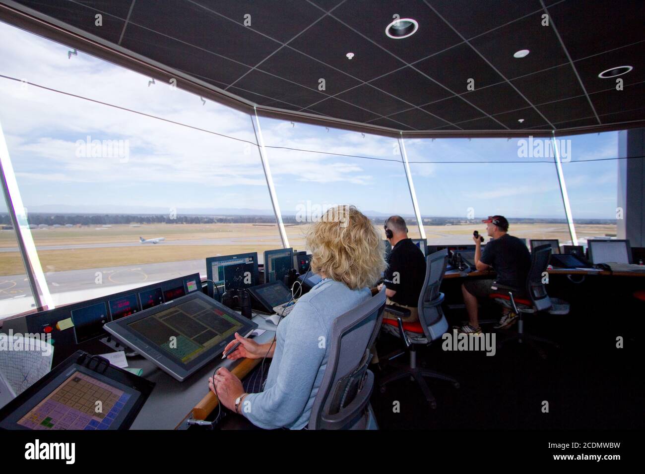 Air traffic controllers monitor aircraft movements at an international airport Stock Photo