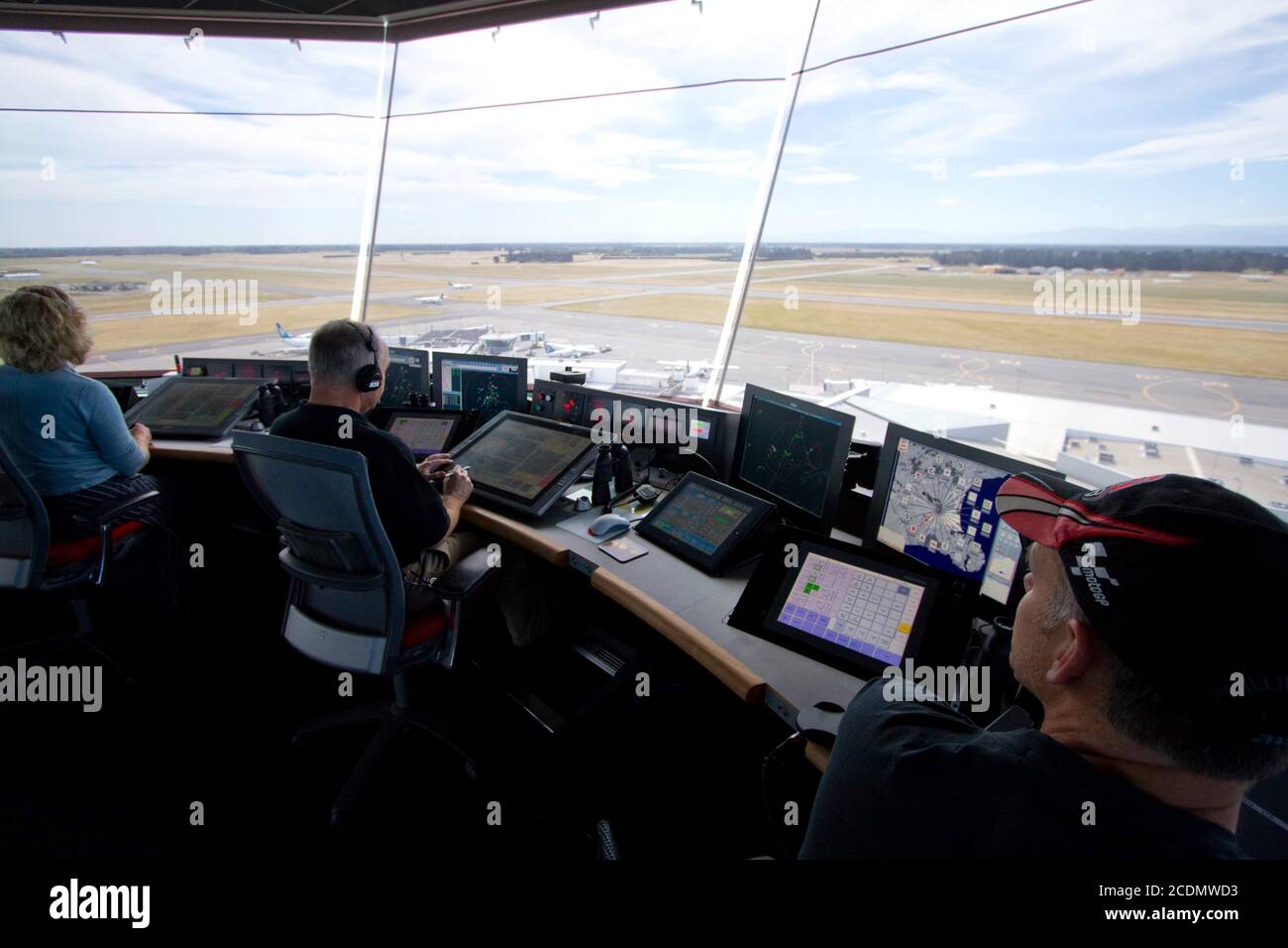 Air traffic controllers monitor aircraft movements at an international airport Stock Photo