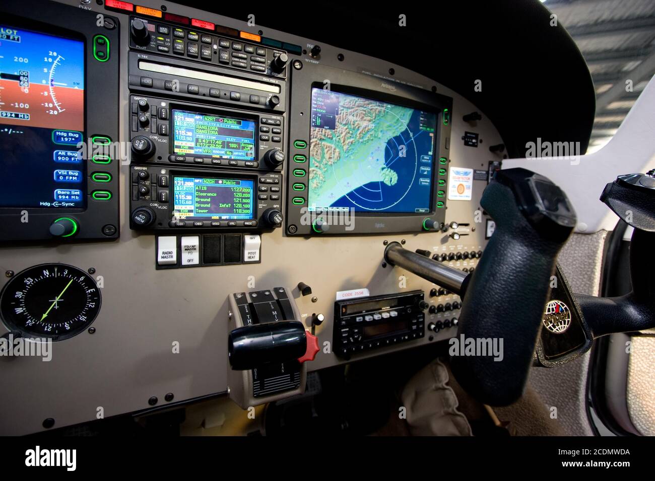 The glass (digital) cockpit and flight controls of a Piper PA-28-181 Archer III. An Avidyne FlightMax avionics display system is installed Stock Photo