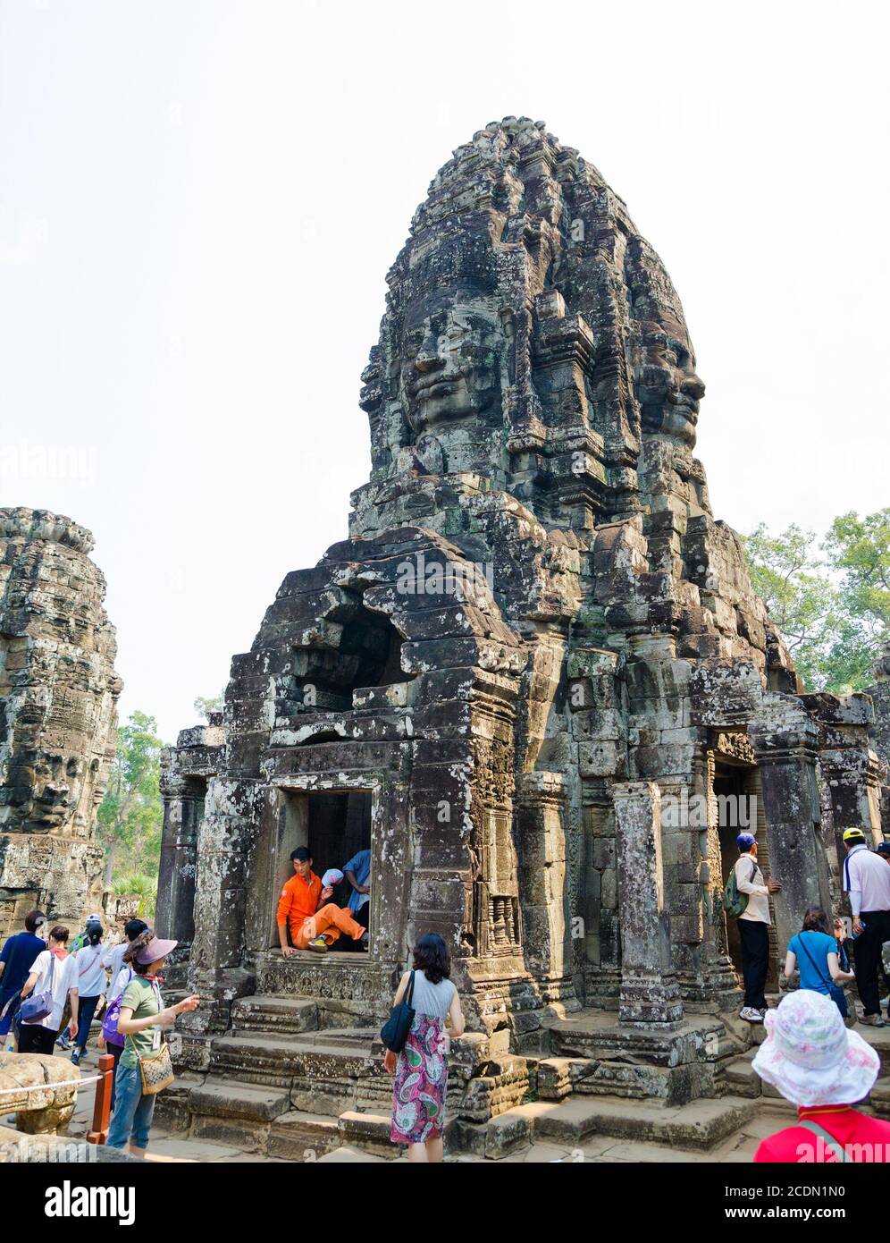 tourists at Bayon in Angkor, Cambodia Stock Photo