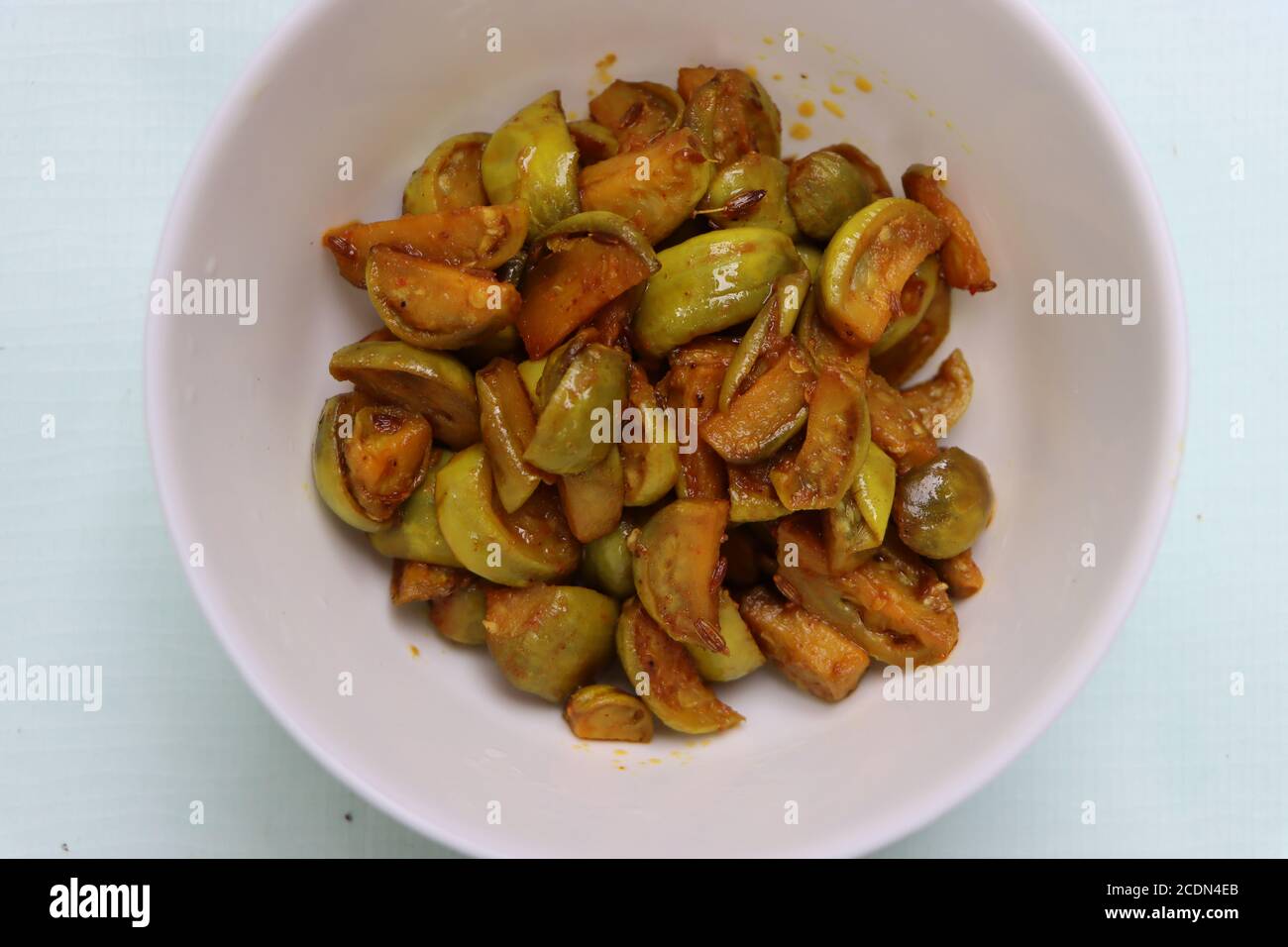 Wild eggplant dry fry, Solanum aethiopicum, traditional local food Stock Photo