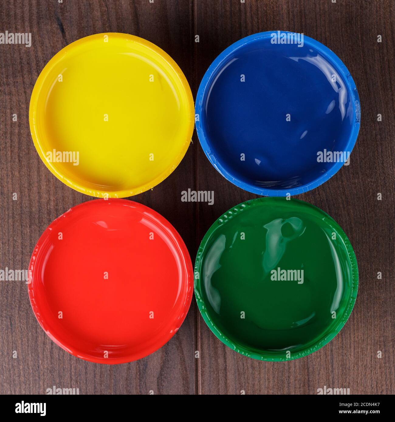 cans with paint on the wooden table Stock Photo