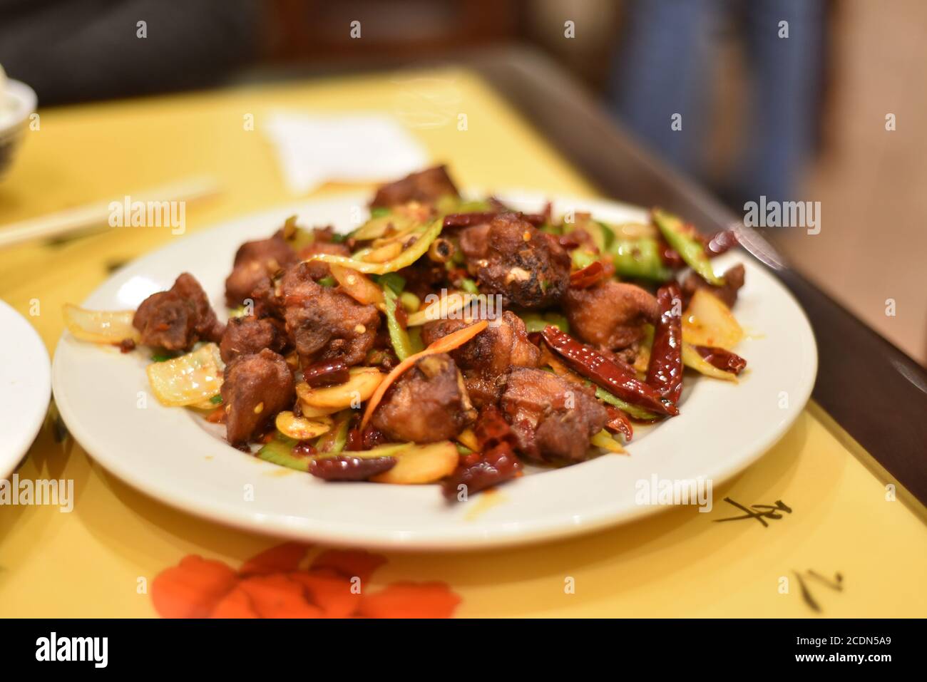 Chinese food: stirred meat with red chilly pepper. A friend of mine from China treated me a couple of Chinese dished. Name unknown. The scene was take Stock Photo