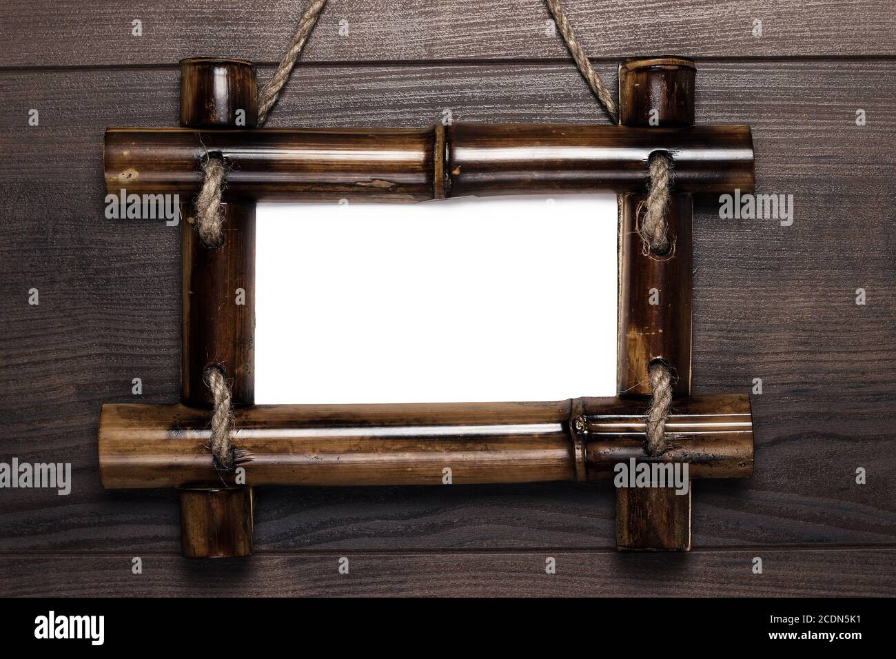 empty frame with copy space hanging on wooden wall Stock Photo - Alamy