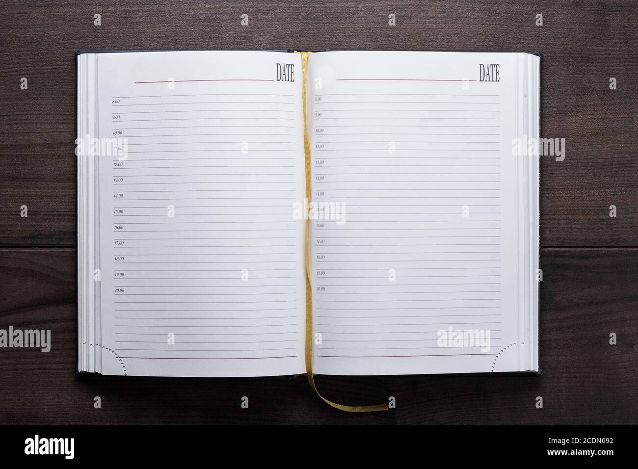 opened notebook on the wooden table Stock Photo