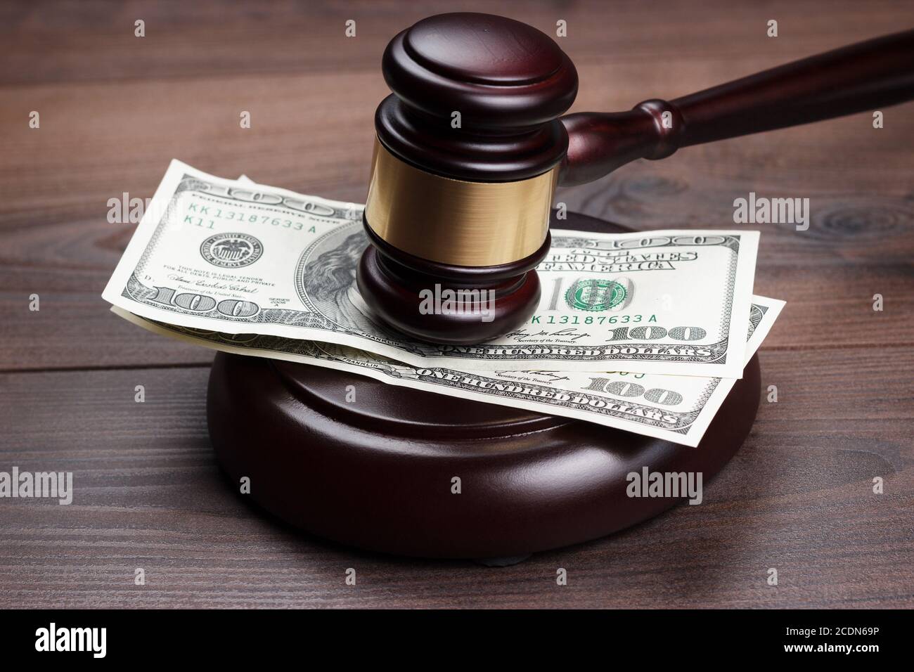 judge gavel and money on brown wooden table Stock Photo