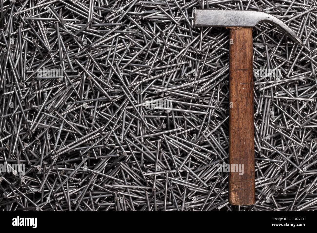 old hammer and nails on table Stock Photo
