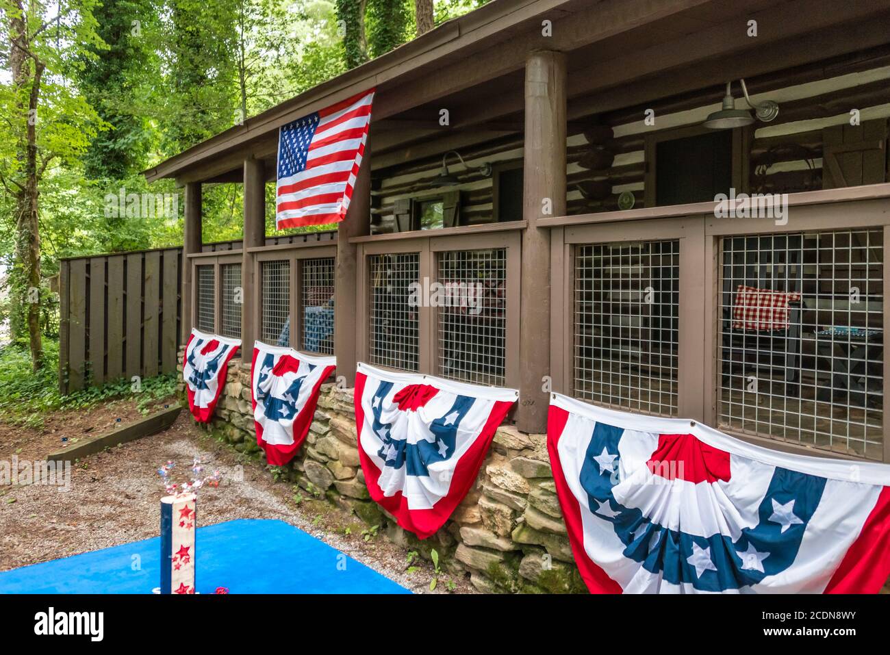 Historic Civilian Conservation Corps era cabin at Vogel State Park with visitor decorations during a Fourth of July week family reunion at the park. Stock Photo