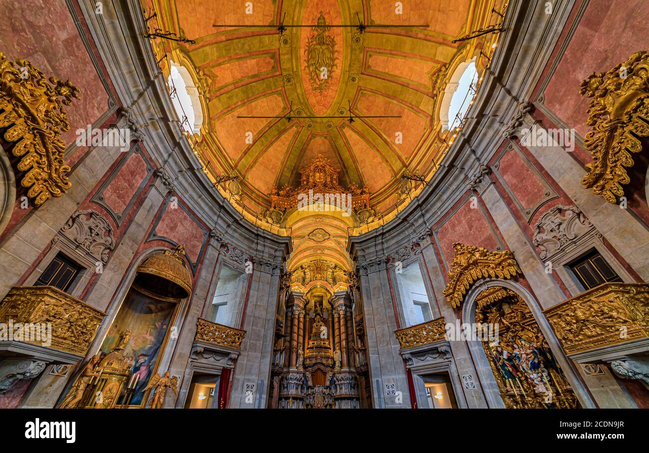 View of the ornate baroque interior with a marble altarpiece of the Igreja dos Clerigos church in old town, a symbol of Porto, Portugal Stock Photo
