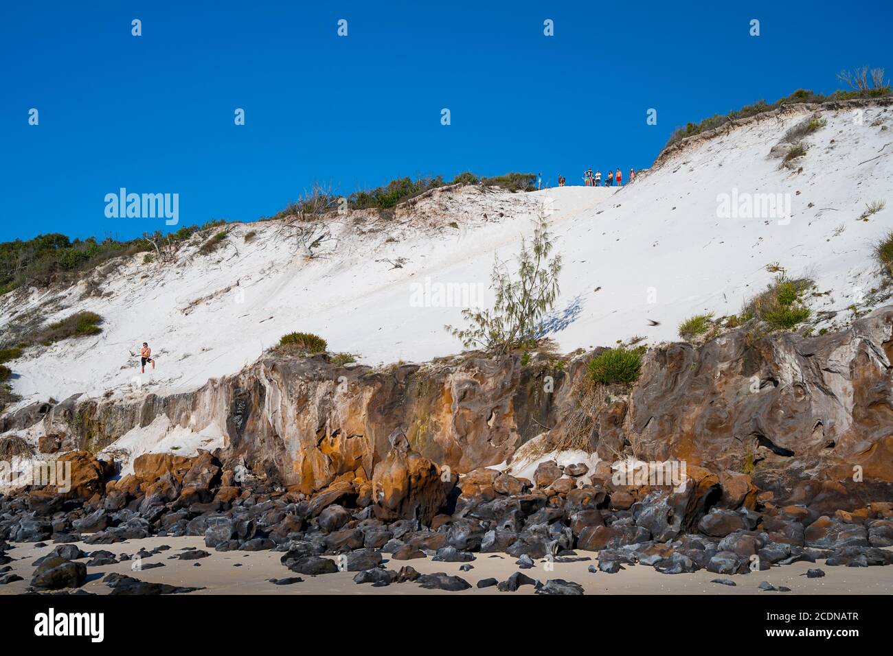 Tourists atop sand dune on western shore of Fraser Island, Hervey Bay, Queensland Australia Stock Photo