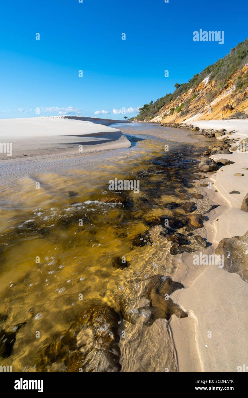 Bowarrady Creek flowing along front of sand dunes West Coast of Fraser Island, Hervey Bay, Queensland Australia Stock Photo